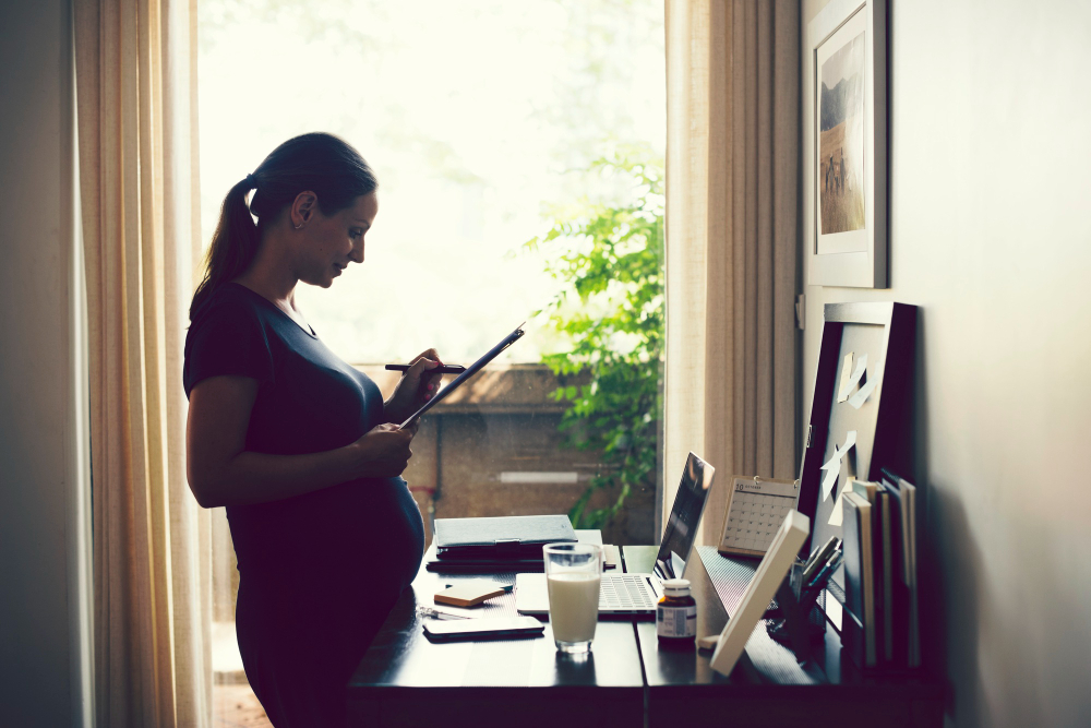 Pregnant woman working from home